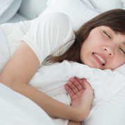 woman grinding teeth in sleep